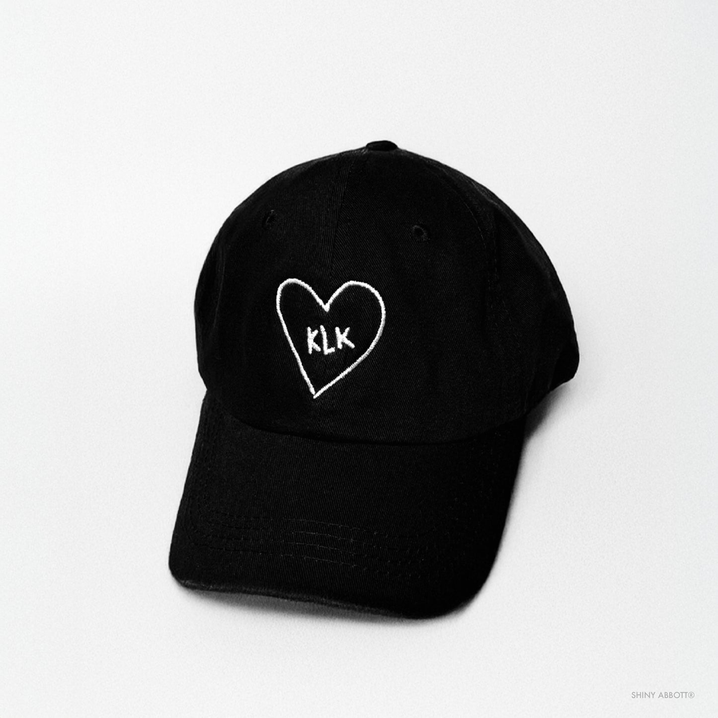 Black Baseball Cap with White KLK Heart Embroidery