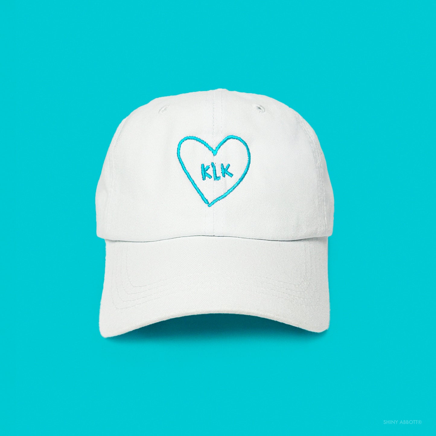 White Baseball Cap with Aqua KLK Heart Embroidery