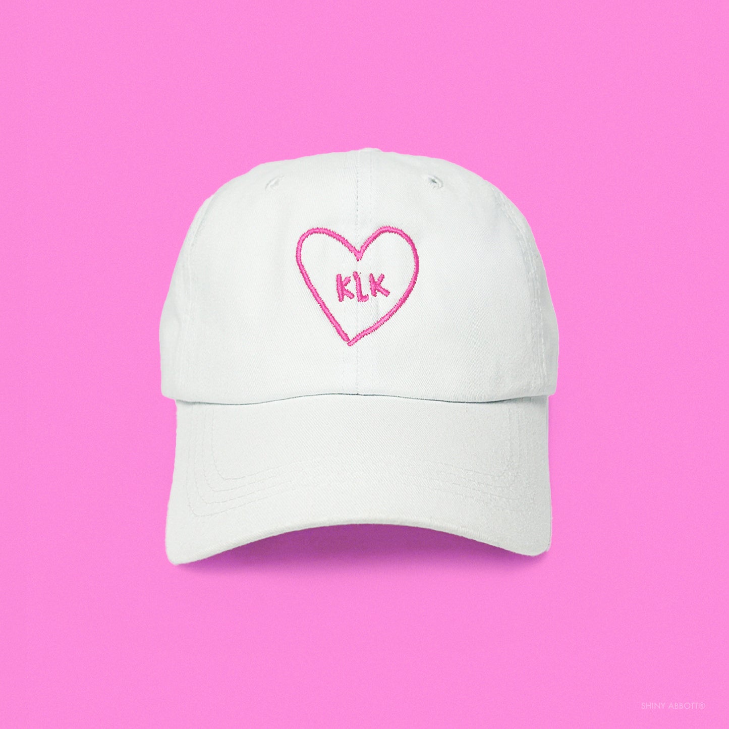 White Baseball Cap with Pink KLK Heart Embroidery