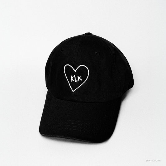 Black Baseball Cap with White KLK Heart Embroidery