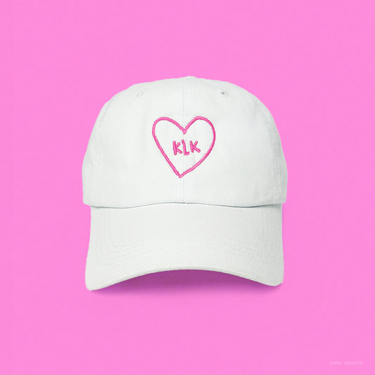 White Baseball Cap with Pink KLK Heart Embroidery